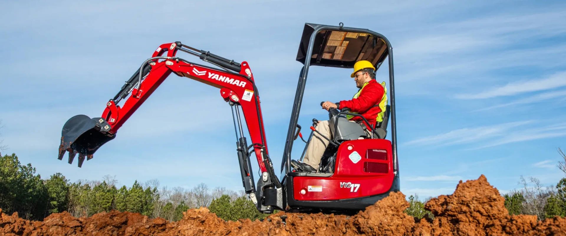Compact excavator working at a job site